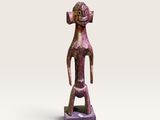 sculpture représentant un homme avec une tête sur la tête