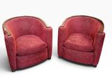 pair of art deco lounge chairs in red velvet upholstered with brass trim