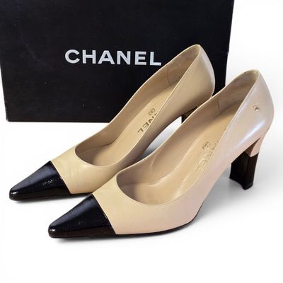 chanel beige and black pumps