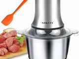 un robot ménager contenant de la viande, avec une spatule à côté