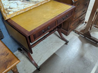 a desk with a mirror on top of it in a room