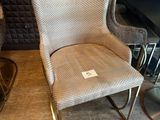 a chair that is next to a table in a room
