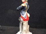 a figurine of a soldier holding a sword