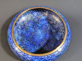 an image of a blue bowl sitting on top of a table