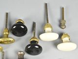 many different types of knobs and handles on a table