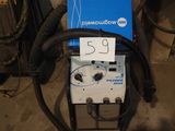 an image of a machine that is sitting in a garage