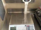 an image of a scale with a calculator on top of it