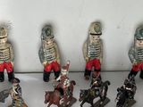 many figurines of soldiers on display on a table