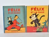 three children ' s books are lined up on a white surface