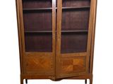 an image of a wooden cabinet with glass doors