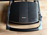 a toaster on a table with a knife and a knife rest on it