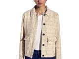 the woman is wearing a jacket and jeans and a white t - shirt