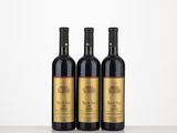 three bottles of wine sitting on top of a table next to each other
