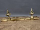 pair of antique brass candlesticks on a wooden table
