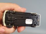 a person holding a small device in their hand