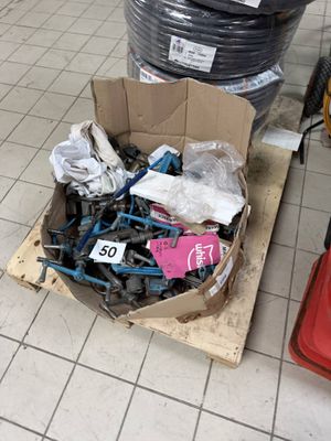 a cardboard box filled with assorted items on the floor