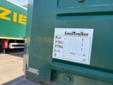 a green truck that is parked next to a green truck
