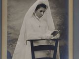 a black and white photo of a woman in a wedding dress