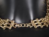 a close up of a gold necklace on a mannequin mannequin mannequin mannequin mannequin mannequin mannequin manne