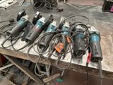 a lot of power tools sitting on a table