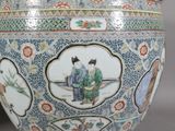 a vase with a picture of a man and a woman on it
