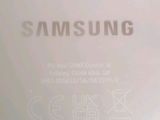the back of a white samsung phone with the logo on it