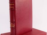 red book on a red book stand on a white background