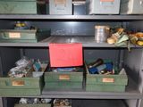 many bins and boxes on the shelf in the room