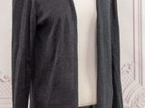 a close up of a mannequin mannequin wearing a gray cardigan