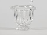 a glass cup with a straw in it on a table
