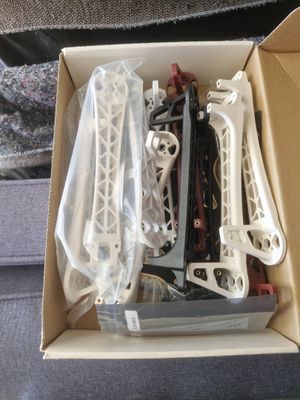 a box of assorted items sitting on a couch
