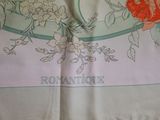 a white table cloth with a floral design on it