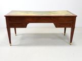 a wooden desk with a marble top and brass legs