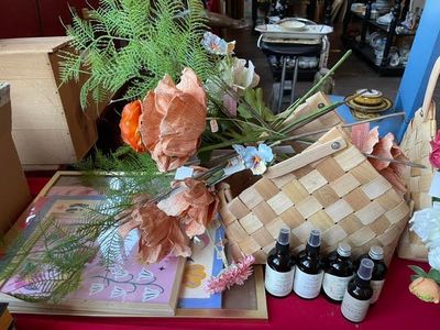 many bottles of wine and flowers on a table