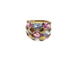 a close up of a gold ring with multi colored stones