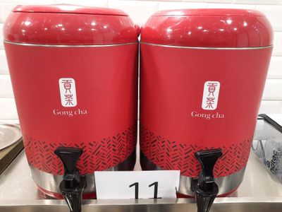 two red containers that are sitting on a counter