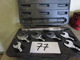 a tool kit that includes a wrench, wrenches, and a wrench