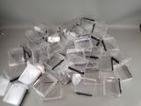 a pile of clear plastic containers on a table