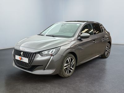the grey car is parked in a room with a black floor