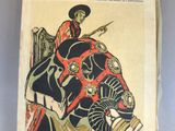 un vieux livre sur lequel figure l'image d'un homme chevauchant un éléphant