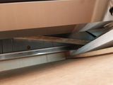 a close up of a pair of scissors cutting a piece of metal