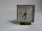 a small clock that is sitting on a table