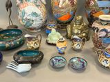 many different vases and bowls on the table