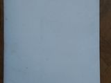 a piece of white paper on a wooden table