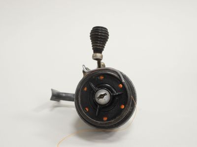 a close up of a small black object on a white surface