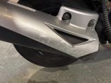 a close up of a motorcycle that is parked in a garage