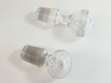 two empty wine glasses sitting on a white table