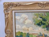 a picture of a painting in a gold frame on the wall