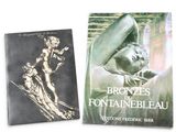 two books on a white background one is a bronze statue and the other is a black and white photo