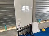a white board sitting on a blue mat in a room